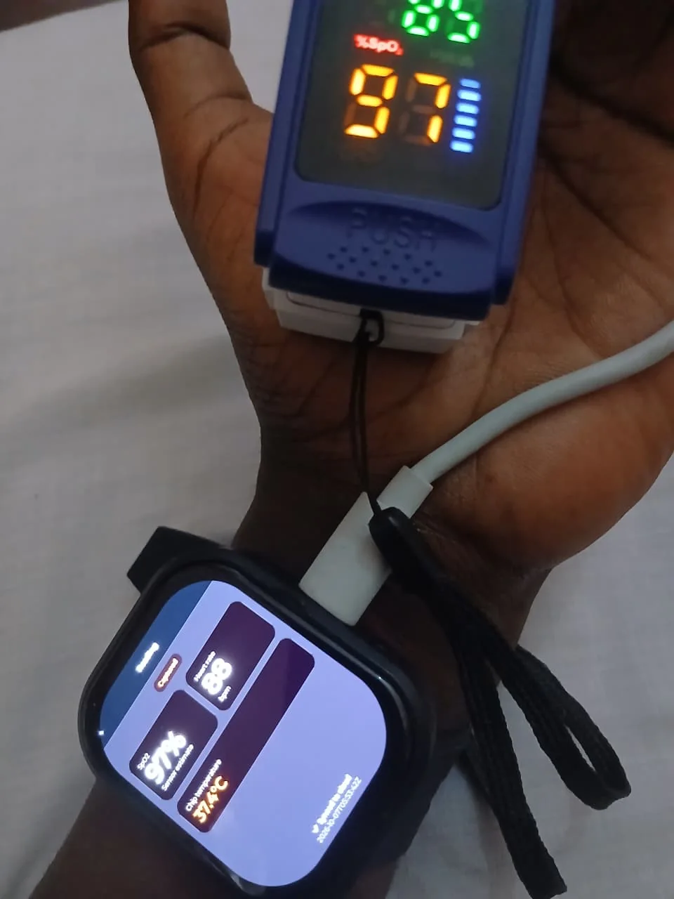 Wearable prototype and reference pulse oximeter during integration work